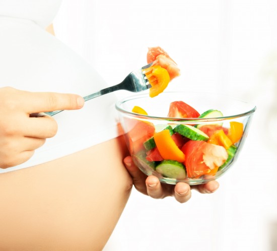 healthy nutrition and pregnancy. pregnant woman and vegetable sa